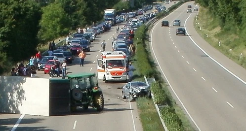 A highway accident with an overturned semi.