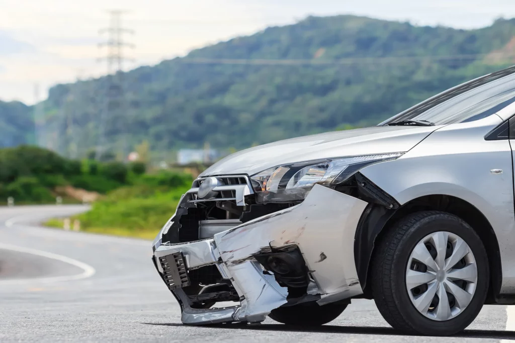Silver car with damage to front end from car crash. The Kansas City car crash lawyers at Yonke Law can get you the compensation you deserve after a car accident.
