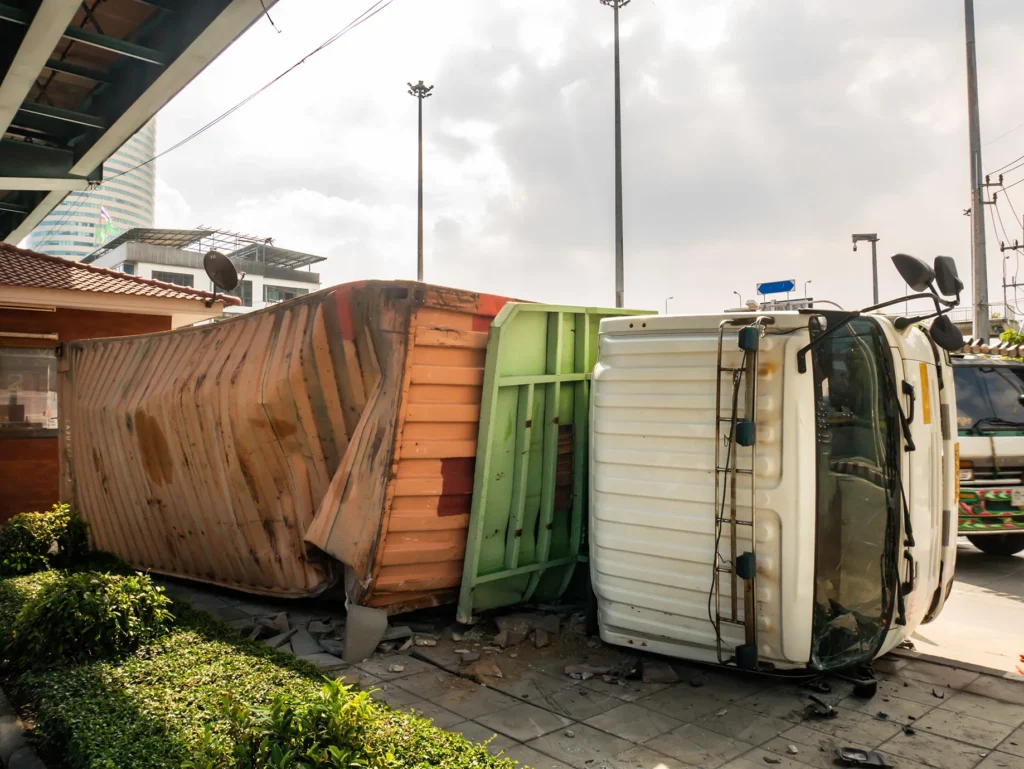 Commercial truck tipped on its side under an overpass. Our truck accident attorney in Kansas City knows how to fight for those injured by commercial trucks.