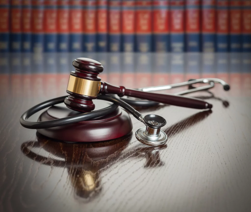 Judge gavel and stethoscope representing medical malpractice. Contact the Kansas City medical malpractice lawyers at Yonke Law if you’ve endured pain & suffering due to negligent medical staff.