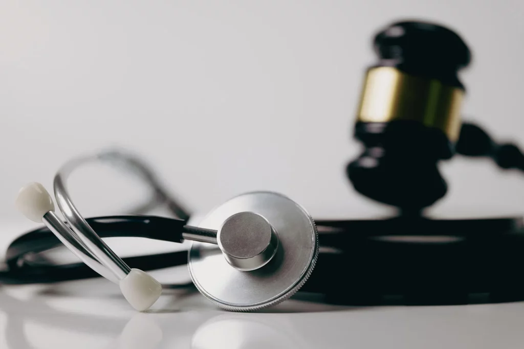 Gavel and stethoscope. Our Kansas City personal injury lawyers defend those injured in medical malpractice cases. 