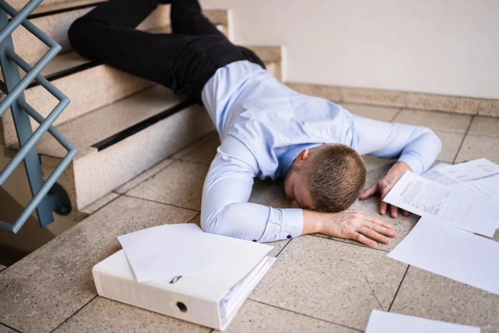 A man who has slipped and fallen down stairs due to the negligence of a property owner and needs a Kansas City slip and fall lawyer.